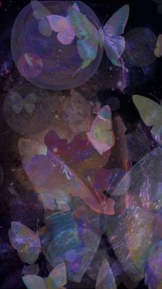 some bubbles floating in the air next to each other on a black background with white and pink colors