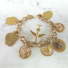 A Womens Vintage Estate 14k Gold Charm Bracelet. The Bracelet Weighs 33.8g, And Measures 7" Long. All Are Marked 14k Except For One Of The Child Tags And The One With Rose Gold. The Grape Leaf Rose Gold Charm Is 10k. Any Questions Please Don't Hesitate To Ask. This Makes A Great Gift For That Someone Special. Be Sure To Check Out Some Of My Other Great Items Up For Sale. Thank You. Rose Gold Charms, Grape Leaf, Gold Charm Bracelet, Gold Charm, Charm Bracelets, Womens Jewelry Bracelets, Great Gifts, Charm Bracelet, Rose Gold