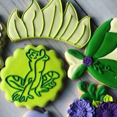 decorated cookies with flowers and leaves on a table