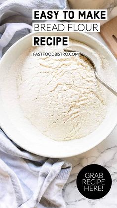 a white bowl filled with flour on top of a marble counter