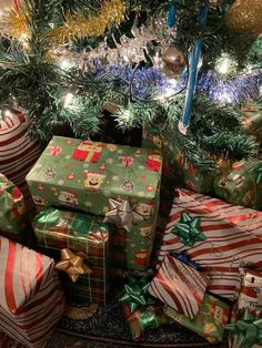 many wrapped presents under a christmas tree