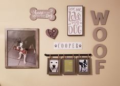 a wall with pictures, frames and magnets on it that say woooff