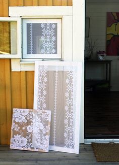 there is a window with white lace on it