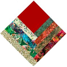 a patchwork quilt with red and green colors