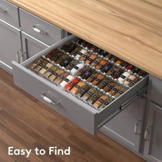 an open drawer with spices in it