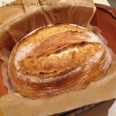 a loaf of bread sitting on top of a brown paper bag