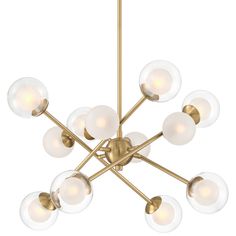 a large chandelier with white glass balls hanging from it's brass frame