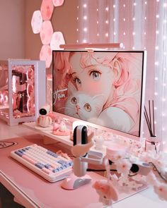 a computer desk topped with a monitor and keyboard next to a pink flowered wall