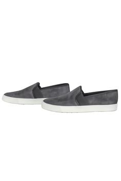 Slip on some serious sporty chic style with these sneakers from Vince! Made with a soft suede design and slip-on style, these grey beauties are weekend-ready. Whether you're headed to brunch or bopping around town, style these with joggers and a graphic sweatshirt and you'll be ready to hit the streets! Size 5 Suede upper Manmade sole Slip on Round toe No visible wear Box included Length 9.75" Gray Slip-on Sneakers For Streetwear, Casual Spring Slip-on Sneakers With Studded Outsoles, Sporty Gray Synthetic Slip-ons, Gray Synthetic Sporty Slip-ons, Gray Sporty Synthetic Slip-ons, Casual Suede Slip-on Sneakers, Comfortable Gray Slip-on Sneakers With Textured Sole, Gray Synthetic Slip-ons With Textured Sole, Gray Low-top Slip-on Sneakers With Rubber Sole