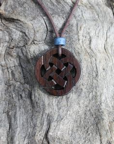 This beautiful and unique hand-carved Celtic Infinity pendant will be made for you, or a loved one, in my studio on the West of Ireland. This delicately carved Celtic necklace features a piece of Rosewood, recycled from musical instruments constructed by a local luthier. As a musician myself, I take enormous satisfaction in creating a piece of jewellery whose inherent wood has previously featured in a beautiful hand-made guitar! Celtic knots date back to the 3rd to 4th century B.C. They were use Celtic Knot Necklace, 5 Year Anniversary Gift, Celtic Necklace, Infinity Pendant, Celtic Knots, Pagan Jewelry, Irish Gifts, Infinity Necklace, Year Anniversary Gifts