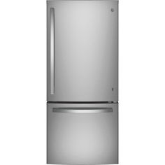 a silver refrigerator freezer sitting on top of a white wall