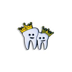 two toothbrushes with crowns on their heads are shown in the shape of a crown