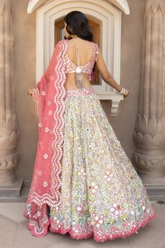 Multicolor attached can-can lehenga with mirror, sequin and zari embroidery. Paired with mirror and zari work, padded blouse and scallop pink dupatta.
Components: 3
Pattern: Embroidered
Type Of Work: Sequin, Zari, Mirror
Neckline: Scoop
Sleeve Type: Sleeveless
Fabric: Net
Color: Multi Color
Other Details: 
Scallop dupatta
Tassel hem blouse
Back tie-up tassel
Lehenga Length approx.: 41-42 inches
Note: Only the product mentioned in the description and images is being sold 
Occasion: Bride,Destinat Scallop Dupatta, Abhinav Mishra, Mirror Sequin, Indian Bridesmaid Dresses, Pink Dupatta, Sangeet Outfit, Mehendi Outfits, Lehenga Designs Simple, Work Lehenga