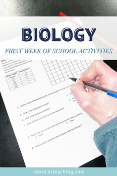 a person holding a pen and writing on a paper with the words, biology first week of school activities