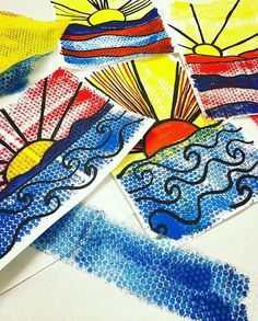 four different colored drawings on white paper with blue, yellow and red colors in the background