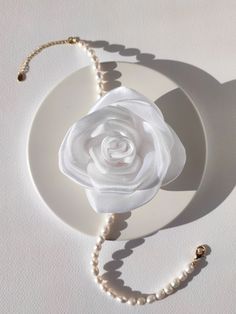 Versatile accessory - white shining organza flower. It looks perfectly with freshwater pearl necklace, but you can easily remove the flower and wear both accessories separately. Flower has needle closure so you can wear it as brooch, necklace or hair accessory. There are two sizes of flowers: - 7 cm / 2.75 in; - 10 cm / 3.90 in. Necklace length: - 35 cm (+5 cm chain)/ 13.8 in (+2 in chain). If you have any questions, want to make an individual change, or simply want to get advise feel free to co White Flower Decorated Jewelry For Parties, White Jewelry With Flower Decoration For Party, White Party Jewelry With Flower Decoration, Pearl White Flower Jewelry For Party, White Flower Decorated Necklaces For Party, White Pearl Jewelry With Flower Decoration, White Party Necklace With Flower Charm, White Necklace With Flower Charm For Party, Formal White Flower Necklaces