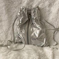 Nwot. Shiny Silver Backpack. Interior Zipper. Metallic Travel Bag With Zipper Closure, Silver Backpack With Zipper Closure, Silver Backpack For Travel, Travel Backpack With Zipper Closure In Silver, Casual Silver Backpack For School, Trendy Metallic Travel Bag, Trendy Silver Backpack For Travel, Silver Backpack For Daily Use, Silver Everyday Backpack