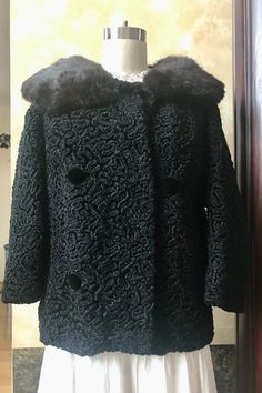 Gorgeous Vintage 1950s Majestic Black Persian Lambs Wool Coat with Fur Collar  Label: No Label No Tag Size Material: Fur / Lambswool Measurements:   recommend you compare to garments you currently wear to determine fit  Measurements taken with the garment lying flat S2S: ~17 1/2 - 18" Bust / Chest: 39" Sleeve:  17 1/2" raglin sleeves Length:  24" Hem: 40" Condition: Excellent Please review the photos carefully.  We examine each item carefully and do our best to note imperfections.  Please understand that vintage items are not new. All items are pre-loved and sold AS-IS.   Please reach out with any questions; we are here to help. Thank you for looking! Vintage Black Outerwear With Buttons, Vintage Winter Evening Outerwear, Vintage Black Winter Outerwear, Vintage Outerwear In Vintage Black For Winter, Vintage Black Wool Outerwear, Fitted Vintage Black Outerwear, Vintage Black Fitted Outerwear, Black Retro Wool Outerwear, Retro Black Wool Outerwear