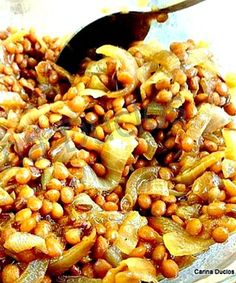 a bowl filled with cooked beans and onions