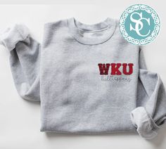 Western Kentucky Hilltoppers shirt!  Unisex Sizing!  The sweatshirt listed has the design on a sport gray shirt (1st photo), but we can also do on a different color sweatshirt!  For an option not listed, send us a message!  🔹T SHIRTS🔹 Adult S-XL Adult 2X Adult 3X 🔹LONG SLEEVE & SWEATSHIRTS🔹  Adult S-XL  Adult 2X Adult 3X If you would like to request a custom order,   please send us a message! Gray Crew Neck Top For Campus, Gray Varsity Top For College, College Heather Grey Tops With Letter Print, Heather Grey Letter Print Top For College, Sporty Heather Grey Tops For College, Heather Grey Graphic Print Top For College, Wku Hilltoppers, Game Day T Shirt, Kentucky Shirts