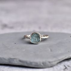 "✦ Introducing our Raw Aquamarine Ring! This beautiful piece is perfect for any crystal lover or jewelry enthusiast. Each ring is handmade with a raw Aquamarine gemstone set in a sterling silver band. The natural beauty of the stone makes this ring a truly unique and one-of-a-kind piece. Aquamarine is known as the \"water\" stone and has a long history of being associated with the ocean. It is said to be a stone of courage and fortitude, helping to overcome fears and phobias. Aquamarine is also Unique Silver Engagement Rings Bohemian, Raw Aquamarine Ring, Delicate Silver Crystal Ring As Gift, Delicate Silver Crystal Ring For Gift, Minimalist Aquamarine Ring Jewelry, Minimalist Aquamarine Ring For Gift, Minimalist Aquamarine Ring Gift, Minimalist Aquamarine Jewelry, Aquamarine Gemstone Crystal Ring Gift