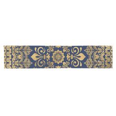 a blue and gold ribbon with an ornate design