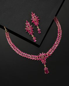 * CZ zirconia necklace and a pair of earrings * Pink gold-plated American diamond studded leaf shaped necklace, has a hook closure * A pair of matching drop earrings, secured with post and back closure *Size:- Length of necklace: 41 cm Length of earrings: 4.5 cm *Material:- Material: Brass Plating: Gold-Plated Stone Type: CZ, Zircon American Diamonds NOTE All the raw material used in this product is of high quality and is handcrafted with love. Premium Quality and High craftsmanship 100% Satisfa Ruby Pendant Indian, Ruby Necklace Indian Gold, Ruby Necklace Indian, Ruby Gold Necklace, Ruby Stone Necklace, Ruby Necklace Gold, Emerald Diamond Necklace, Gold Ruby Necklace, Ruby Jewelry Necklaces