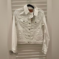 White Denim Jacket From Levi’s With The Tags On. Size Small. Unworn! Fitted White Denim Jacket With Button Closure, Fitted White Denim Jacket For Spring, White Fitted Denim Jacket For Fall, Fitted White Denim Jacket For Fall, Trendy White Button-up Denim Jacket, White Cotton Denim Jacket With Button Closure, Classic White Denim Jacket For Fall, Classic White Denim Jacket With Pockets, White Button-up Denim Outerwear