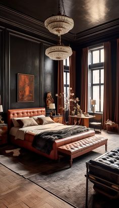 a large bedroom with black walls and wooden flooring is furnished with an elegant chandelier that hangs from the ceiling