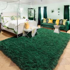 a bedroom with green carpet and white furniture