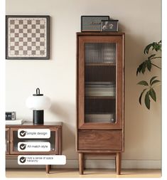 a tall wooden cabinet sitting next to a table