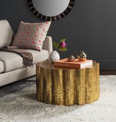 a living room scene with focus on the coffee table and sofa in the foreground