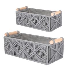 two gray baskets with wooden handles on white background