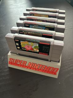 several nintendo games are stacked on top of each other, with the words super nintendo printed on them