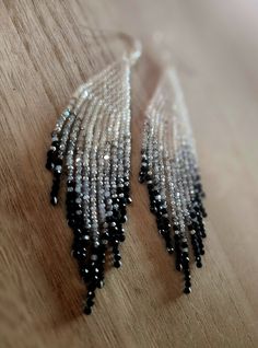 These grey to black ombre beaded earrings are handmade with high quality glass beads imported from India and are finished with silver plated ear wires. Earrings have an irridecent sparkle to them.  They measure 4 inches in drop length and weigh 4 grams per earring. They are  lightweight. Ships within 2 business days of purchase. Adjustable Silver Beaded Earrings With Black Beads, Red Bead Earrings, Black Ombre, Red Bead, Ear Wire, Ear Wires, Color Combos, Beaded Earrings, Jewelry Earrings Dangle