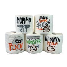 four rolls of toilet paper with halloween sayings on the top and bottom, all labeled in different colors