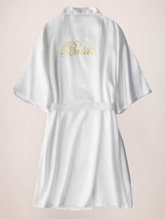 This elegant satin morning robe is a must-have for any bride. With its elegant sleeves and luxurious fabric, it's perfect for getting ready on your special day. Feel comfortable and stylish while you prepare to walk down the aisle. Start your wedding day off right with this beautiful robe.

Material: Polyester Fiber (Polyester)
Sleeves: Short SleevesClosure: Front ClosureNote: Final Sale & No Returns White Satin Wedding Dress For Bride, White Satin Honeymoon Robe, White Satin Finish Wedding Gown, Elegant Satin Robe For Honeymoon, White Robe For Mother Of The Bride, Elegant Long Sleeve Robe For Bridal Shower, White Satin Bridal Shower Robe, White Satin Robe For Bridal Shower, Elegant Satin Bridesmaid Robe