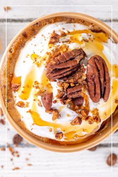 a bowl filled with yogurt and pecans