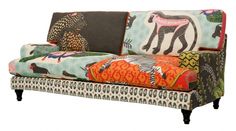 an upholstered couch with animal prints on it