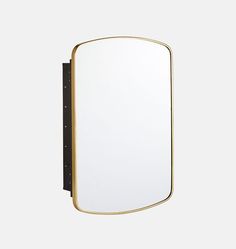 a mirror that is on the wall with a black frame and gold trim around it