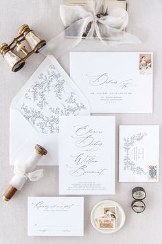 the wedding stationery is laid out and ready to be put into their guests'bags