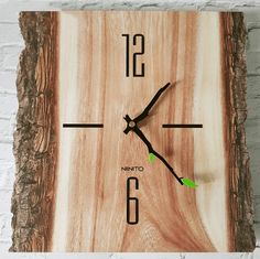 a clock made out of wood with the numbers six and nine on it's face