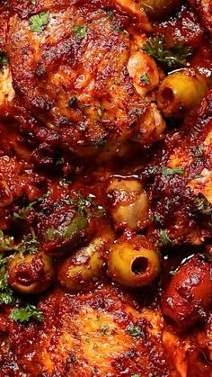 closeup of meat and olives in marinara sauce