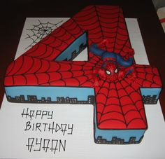 a spiderman cake with the number four on it