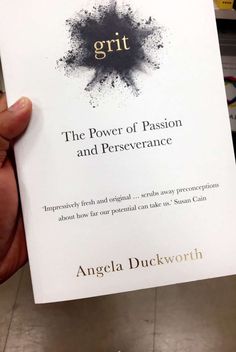 the book grit by angela duckworth is being held in front of a store