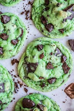 green chocolate chip cookies on a baking sheet ready to be eaten and baked in the oven