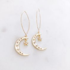 "DESCRIPTION: The AURORA Earrings - Gold crescent moons with Opal and CZ Stars. on a long gold filled ear wire. These celestial statement earrings will add the perfect bit of modern + minimalist vibes to your earring rotation! MATERIALS: Ear Wires - Gold Filled Moon and Star - Gold plated, Opal, CZ stones SIZE: Approximately 2\" in length MATCHING NECKLACE: https://etsy.me/2WOv4aj PACKAGING: Your earrings will arrive on a Dainty Doe signature jewelry card placed in a white jewelry box, with a bo Aurora Earrings, Friend Gifts Birthday, Star And Moon Earrings, Silver Jewelry Cleaner, Earrings Opal, Earrings Star, White Jewelry Box, Star And Moon, Crescent Moon Earrings