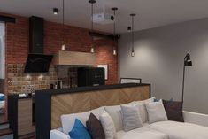 a living room filled with furniture next to a kitchen