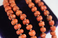 -Antique Sterling Silver Chinese Qing Dynasty Natural Orange Red Coral Necklace -Total length: 14.25 in -Bead size:about 4.15 mm x 6.45 mm ~ 8.55 mm x 6.7 mm -Total weight: 46.6 g -Marked silver, made in China Antique Handmade Orange Necklaces, Orange Large Beads, Luxury Vintage Orange Beads, Unique Polished Orange Beads, Orange Amulet-style Jewelry With Large Beads, Red Coral Necklace, Coral Earrings, Coral Necklace, Qing Dynasty