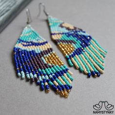 These abstract turquoise beaded earrings are made of high-quality Czech beads and strong synthetic thread. They are elegant, fashionable, and highly versatile, suitable for everyday wear. Features: Sterling silver components Color: blue, turquoise, gold, purple, beige. This item is currently in stock. More beaded earrings http://etsy.me/2ycItdb Gerdan necklaces http://etsy.me/2mihf0J Beaded necklaces http://etsy.me/2Dkf1Fo Crochet necklaces http://etsy.me/2CAPdFc Back to shop https://www.etsy.co Turquoise Beaded Earrings For Festivals, Turquoise Tassel Earrings With Colorful Beads For Festival, Festival Turquoise Beaded Earrings With Colorful Beads, Turquoise Beaded Tassel Earrings For Festival, Festival Turquoise Tassel Earrings With Colorful Beads, Festival Blue Chandelier Earrings With Colorful Beads, Turquoise Tassel Earrings With Colorful Beads, Turquoise Tassel Drop Earrings With Colorful Beads, Turquoise Beaded Chandelier Earrings With Round Beads